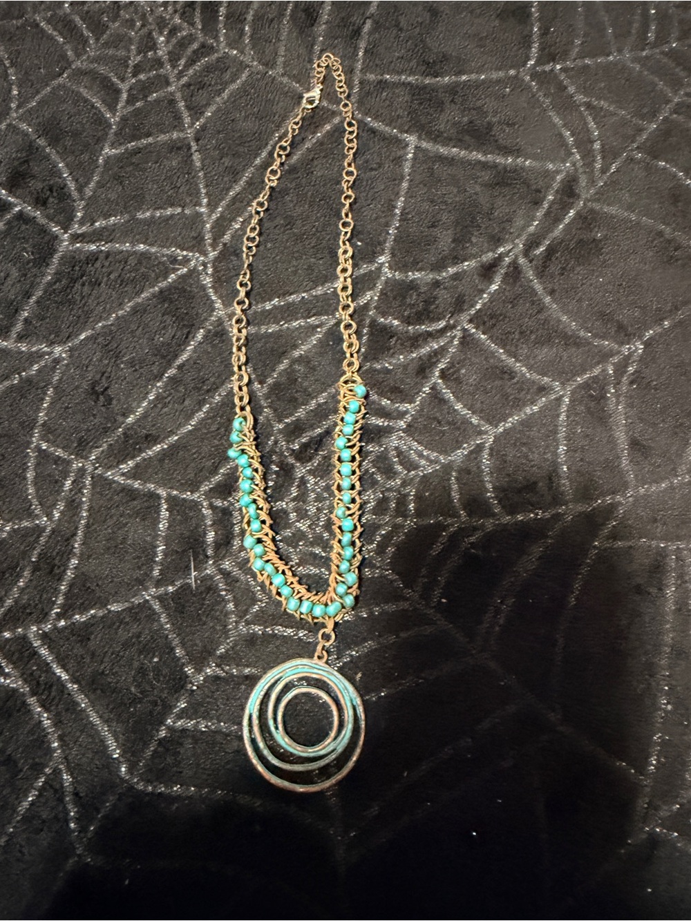 Gold-Tone Necklace with Turquoise Beads and Concentric Circle Pendant